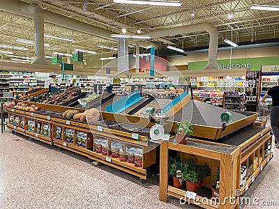 Empty produce department shelves at a Publix grocery store due to the people panicing and hoarding paper and food products Editorial Stock Photo