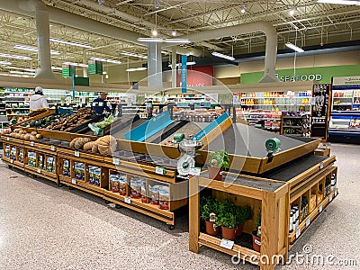 Empty produce department shelves at a Publix grocery store due to the people panicing and hoarding paper and food products Editorial Stock Photo