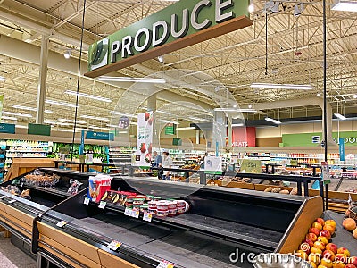Empty produce department shelves at a Publix grocery store due to the people panicing and hoarding paper and food products Editorial Stock Photo