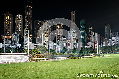 Empty race track and skyline background, Horse racing course in Hong Kong Jockey Club, Happy Valley Stock Photo