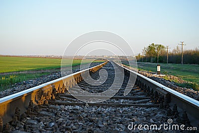 Empty railroad track going into the distance Stock Photo