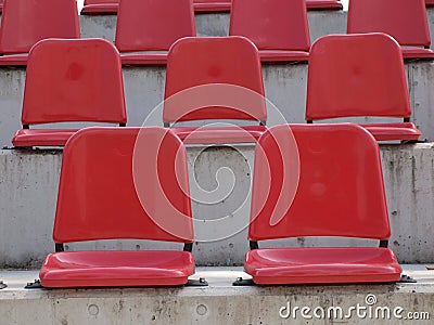 Empty red bleacher seats Stock Photo