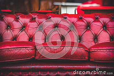 Empty red sofa in cosy lounge room old-fashioned vintage closeup Stock Photo