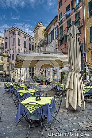 Empty restaurant tables and umbrellas Editorial Stock Photo