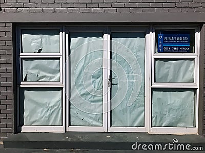 Empty retail stores on high street closed down due to recession and pandemic related causes Editorial Stock Photo