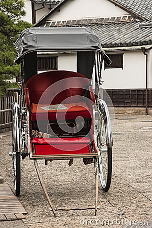 Empty rickshaw parked on street Stock Photo