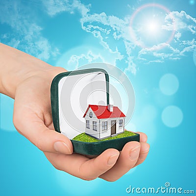 Empty ring box with house in girls hand Stock Photo