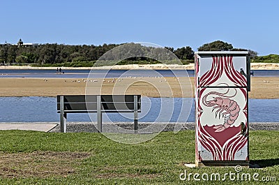 Empty riverside park bench and artwork Editorial Stock Photo