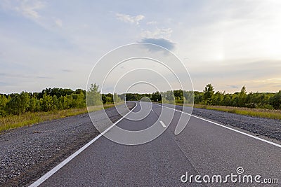 An empty road leading to the village on the hills. Editorial Stock Photo