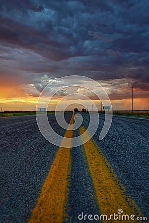 Empty road with storm clouds Stock Photo