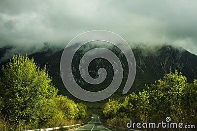 Empty road to the mountain Stock Photo