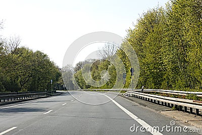 Empty road with trees Driving from Olfen to Dorsten road tripp backgrounds wallpapers in high quality fine art prints Stock Photo