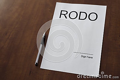 Empty RODO document on wooden desk with pen. Stock Photo