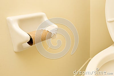 Empty Roll of Toilet Paper in Washroom Stock Photo