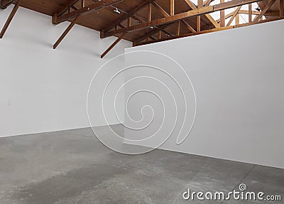 An empty room art gallery with wood ceiling and concrete flooring Stock Photo