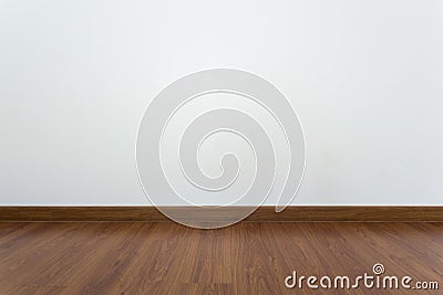 Empty room with brown wood laminate floor and white mortar wall Stock Photo