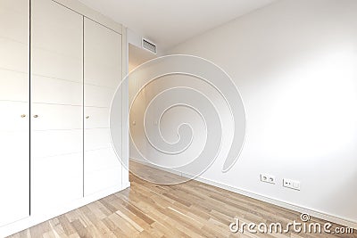 Empty room with built-in wardrobe and ducted Stock Photo