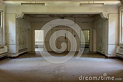 Empty Room with Hand Painted Quote - Abandoned State Hospital - New York Stock Photo