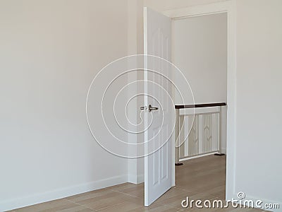 Empty room with open door and white interior wall background. Stock Photo