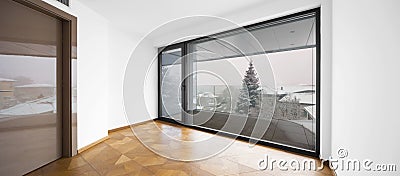 Empty room. It`s snowing outside. Stock Photo