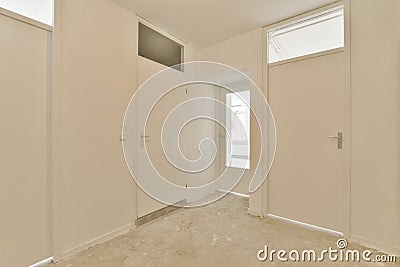 a bedroom with white walls and a window and door Stock Photo