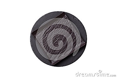 Empty round slate plate for template on the black background Stock Photo