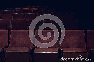 Empty rows of red vintage seats in movie theater Stock Photo