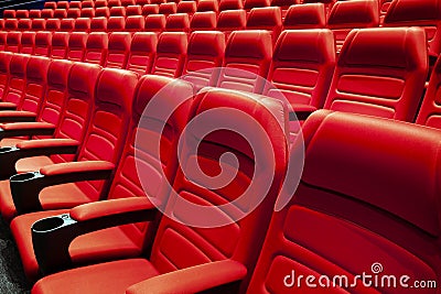 Empty rows of red theater or movie seats Stock Photo