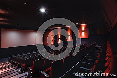 Empty rows of red theater or movie seats. Chairs in cinema hall. Comfortable armchair Stock Photo