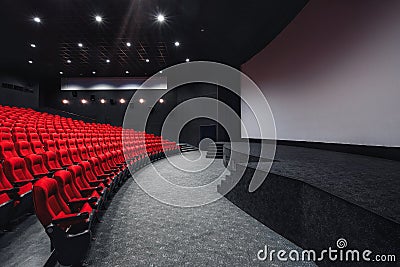 Empty rows of red theater or movie seats. Chairs in cinema hall. Comfortable armchair Stock Photo