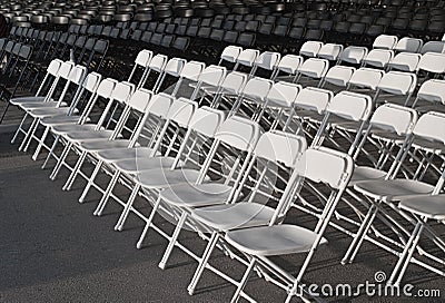 Empty rows of white chairs Stock Photo