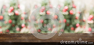 Empty rustic wood table top with abstract blur christmas tree re Stock Photo