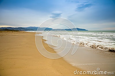 Empty sand beach in Paestum in cloudy day in winter, Cilento, Italy Stock Photo