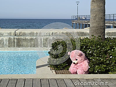 Empty seafront promenade with teddy bear Stock Photo