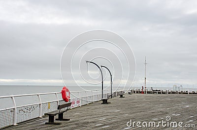 Empty seaside pier out of season Stock Photo