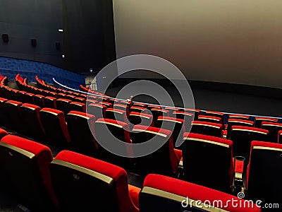 Empty seats in a big-screen cinema without people Stock Photo