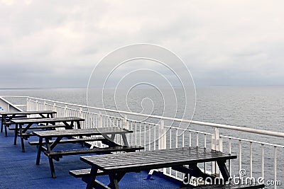 Seats and tables on a ferry boat Stock Photo