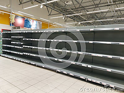 Empty shelves in stores. Empty shelves in stores.Supermarket shelves in perspective. Stock Photo