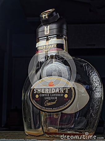 Empty Sheridan`s Coffee Layered Liqueur Bottel Studio shot Lokgram Editorial Stock Photo