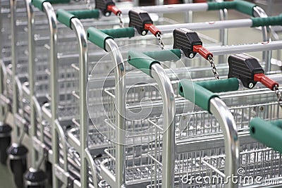 Empty Shopping Carts Linked Together Stock Photo