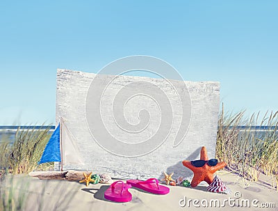 Empty Signboard and Summer Props on Beach Stock Photo