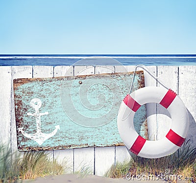 Empty Signboard and Wooden Fence on Beach Stock Photo