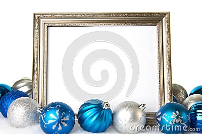 An empty Silver Picture Frame with Blue and Silver Christmas Ornaments Stock Photo