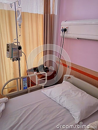 Empty single bed hospital with medical equipment Stock Photo