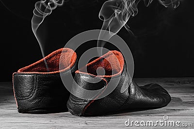 Empty slipper shoe smoke rise Stock Photo