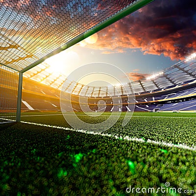 Empty soccer stadium in sunlight Stock Photo