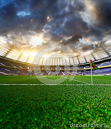 Empty soccer stadium in sunlight Stock Photo