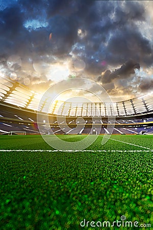 Empty soccer stadium in sunlight Stock Photo