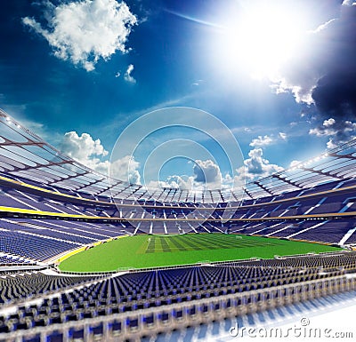 Empty soccer stadium in sunlight Stock Photo