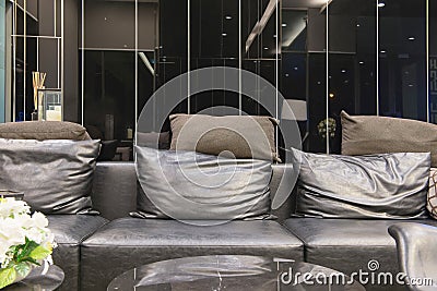 Empty sofa in living room at night, interior design Stock Photo